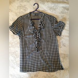 Black/white checked blouse.